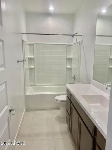 a bathroom with a shower and a toilet
