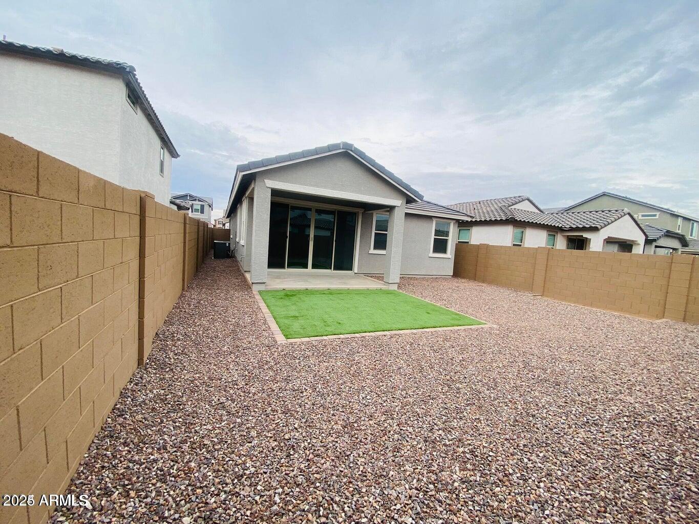 9449 West Roma Avenue Phoenix, AZ 85037 - Photo 4 of 42 a view of house with a yard and potted plants
