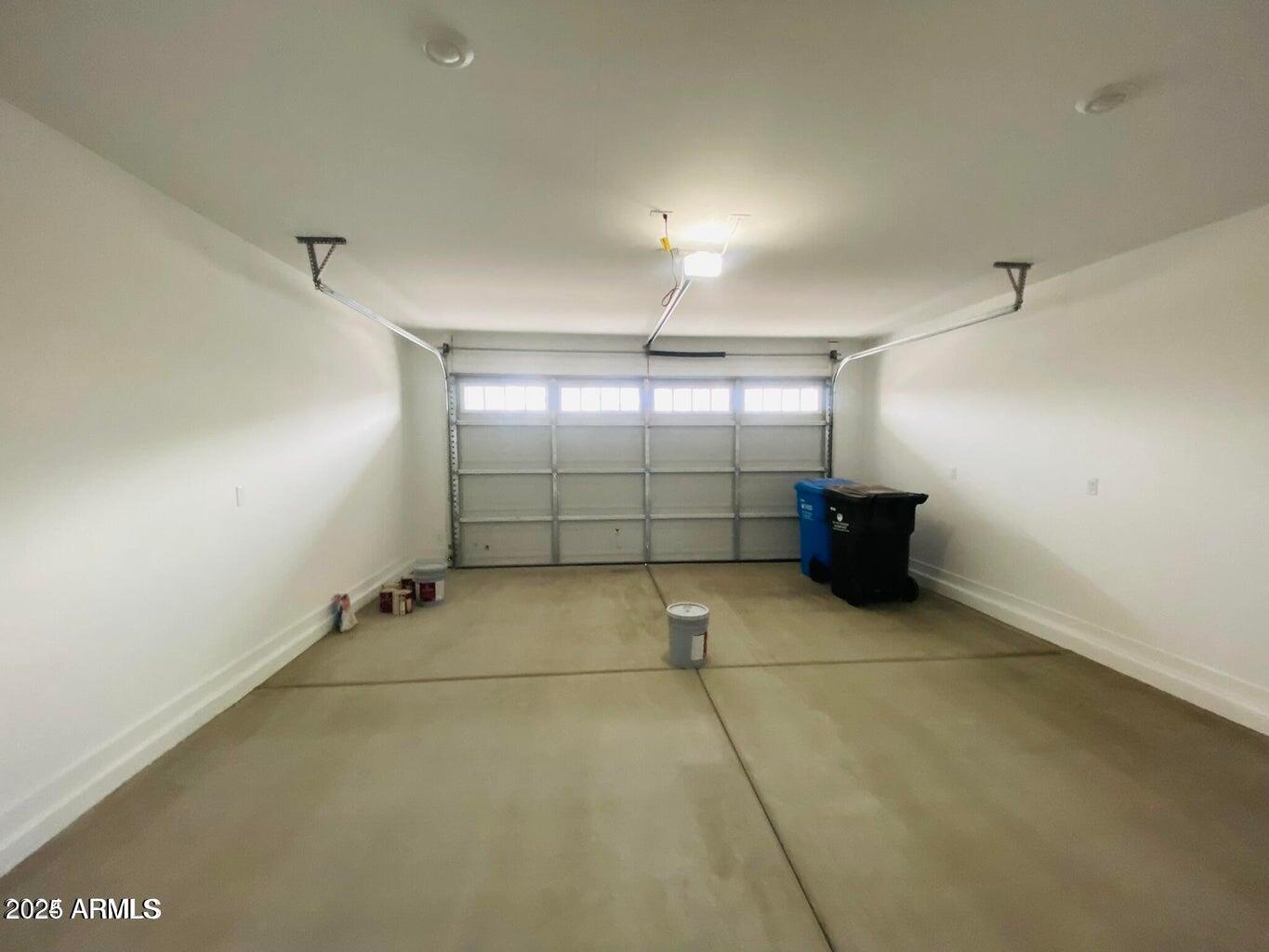 9449 West Roma Avenue Phoenix, AZ 85037 - Photo 41 of 42 an empty room with windows and cabinet