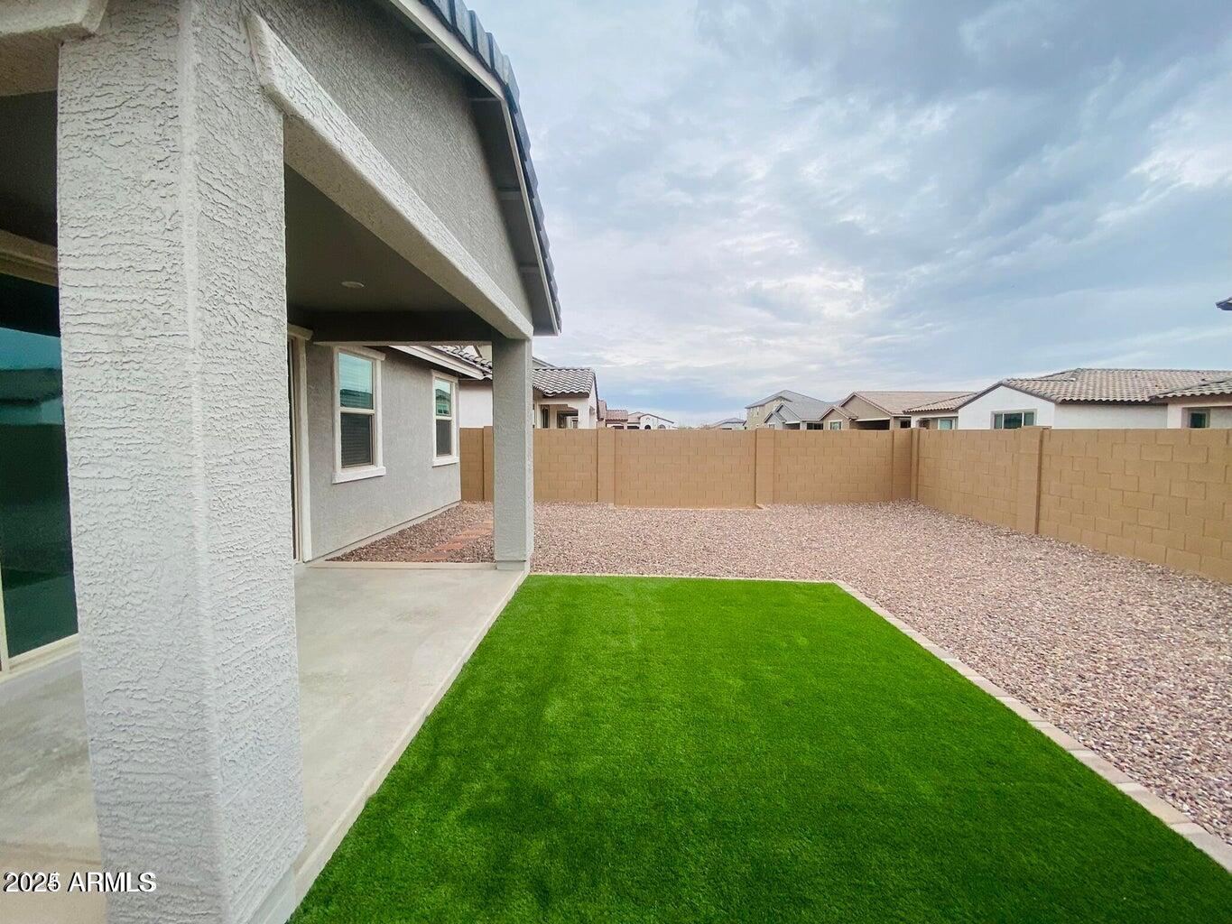 9449 West Roma Avenue Phoenix, AZ 85037 - Photo 6 of 42 a view of a backyard with green space