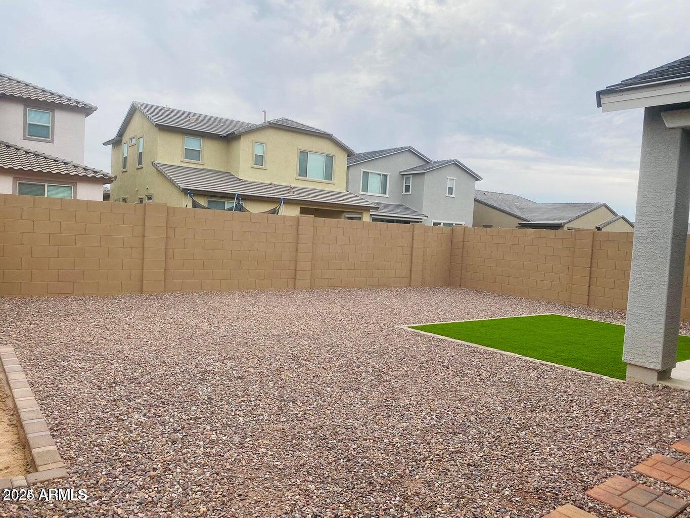 9449 West Roma Avenue Phoenix, AZ 85037 - Photo 8 of 42 a front view of a house with garden