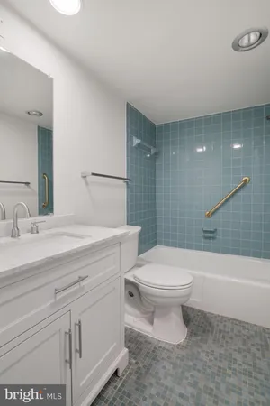 a bathroom with a sink and washing machine