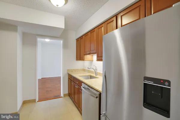 a kitchen with a stove microwave and sink