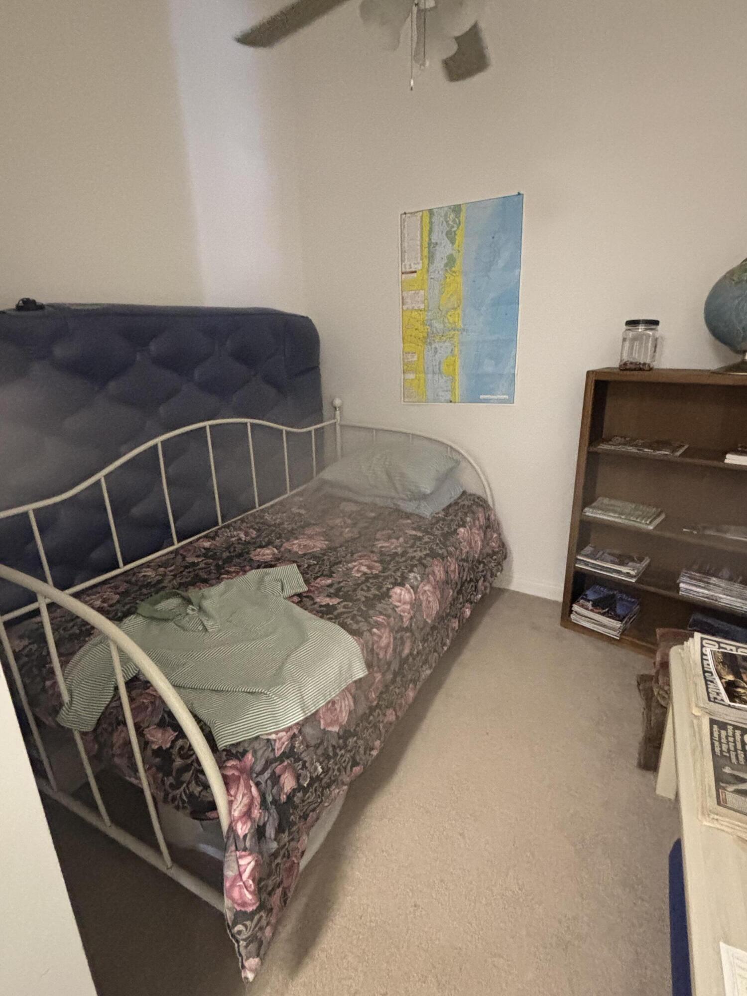 15 Harbour Isle Drive West, Unit PH 5 Fort Pierce, FL 34949 - Photo 19 of 20 a bedroom with a bed and a window