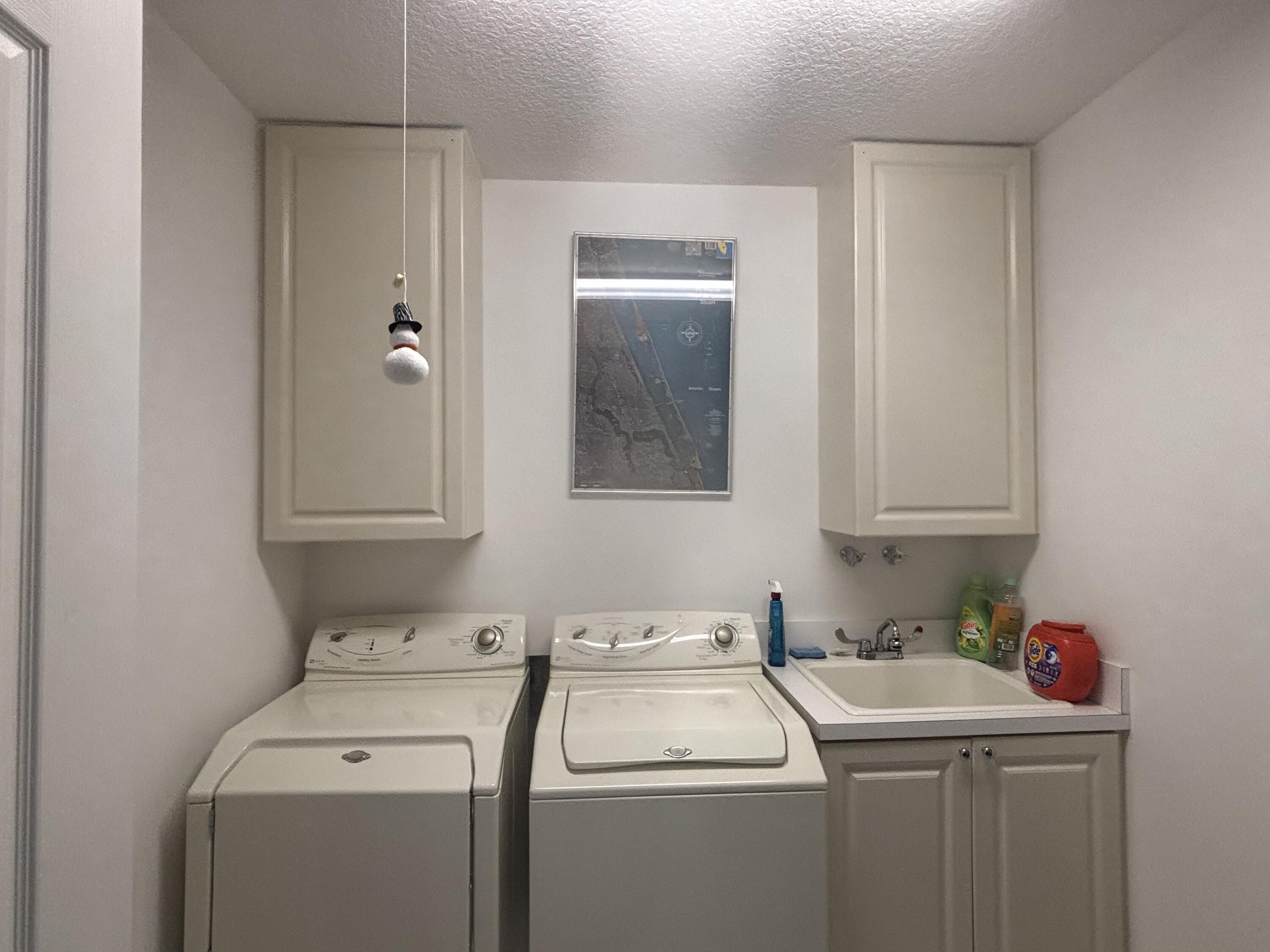 15 Harbour Isle Drive West, Unit PH 5 Fort Pierce, FL 34949 - Photo 20 of 20 a utility room with dryer and washer