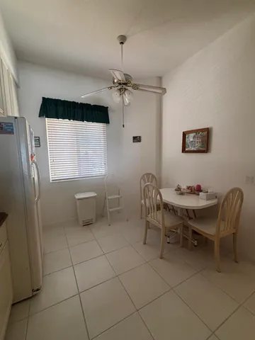 a view of a livingroom with furniture and a window