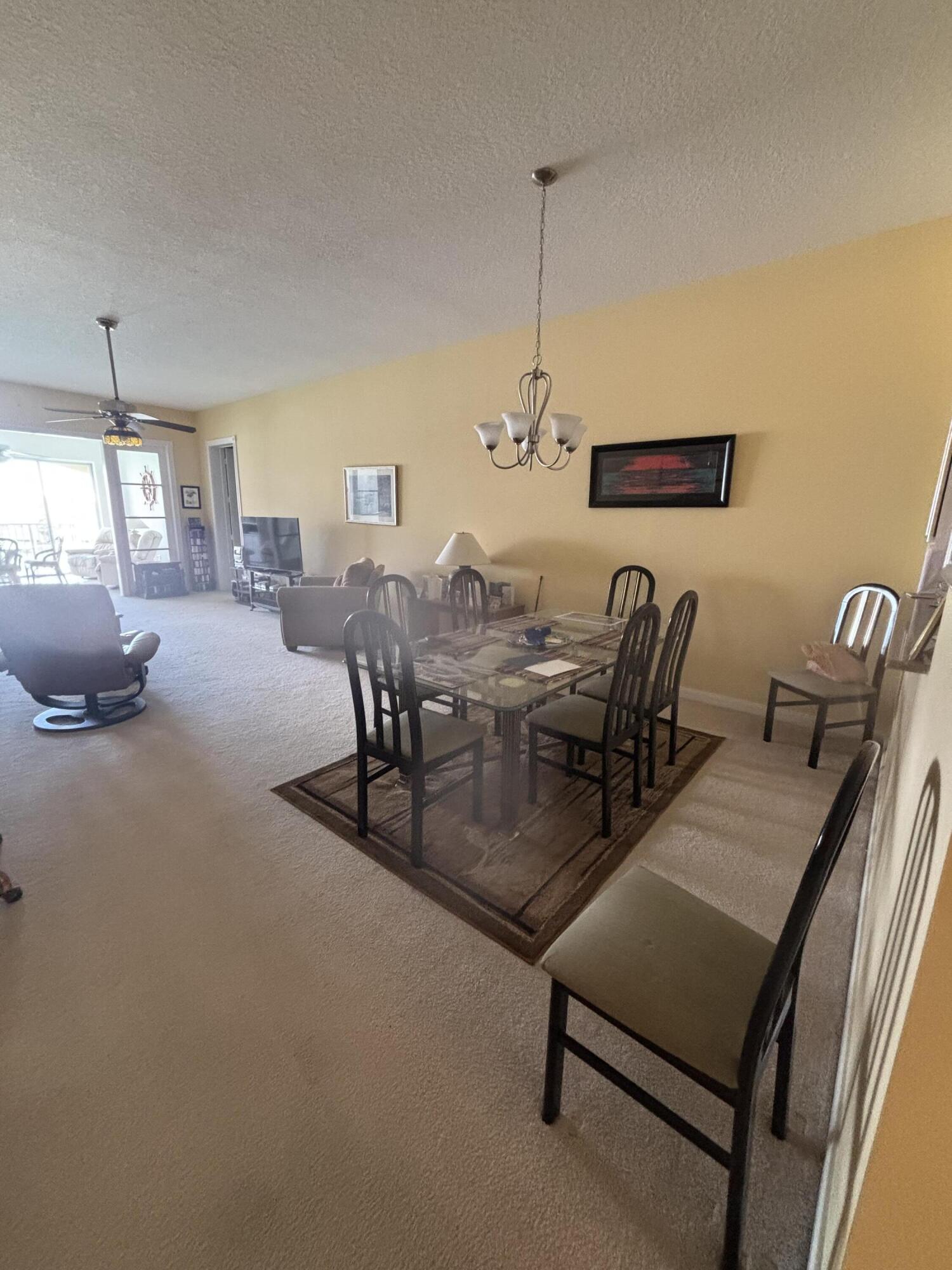 15 Harbour Isle Drive West, Unit PH 5 Fort Pierce, FL 34949 - Photo 6 of 20 a dining room with furniture and window