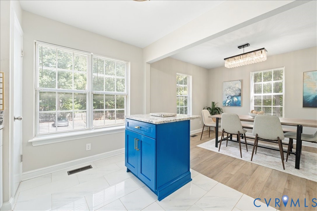 11601 Timberly Waye Henrico, VA 23238 - Photo 11 of 39 a living room with furniture a dining table and a large window