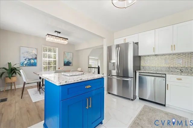 a kitchen with a refrigerator and countertop