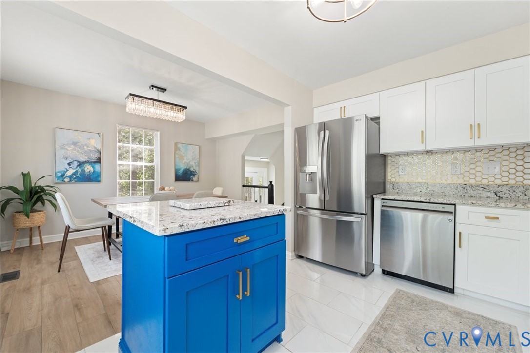 11601 Timberly Waye Henrico, VA 23238 - Photo 12 of 39 a kitchen with a refrigerator and countertop