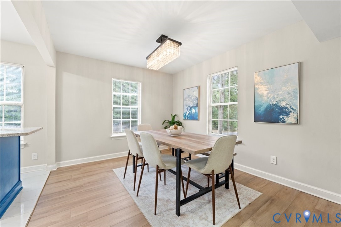 11601 Timberly Waye Henrico, VA 23238 - Photo 13 of 39 a view of a dining room with furniture window and wooden floor