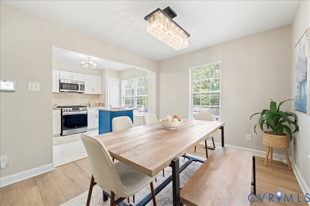 11601 Timberly Waye Henrico, VA 23238 - Photo 14 of 39 a view of a dining room with furniture and a fireplace