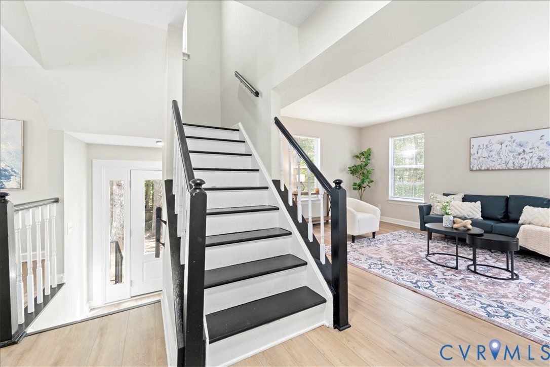 11601 Timberly Waye Henrico, VA 23238 - Photo 17 of 39 a view of a livingroom with wooden floor and stairs