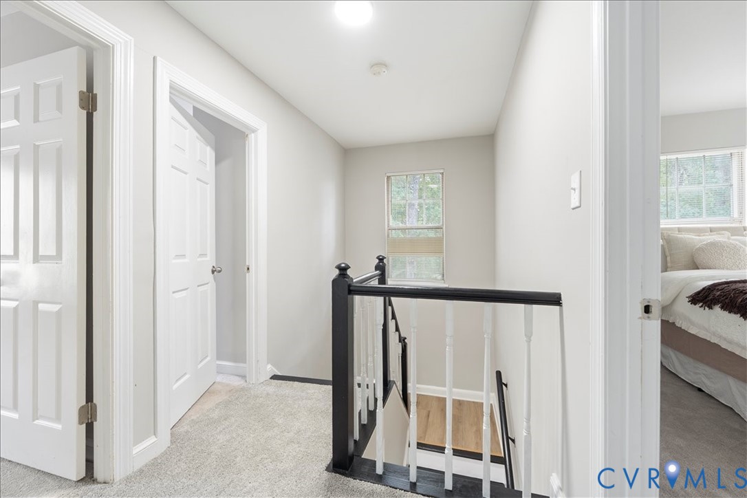 11601 Timberly Waye Henrico, VA 23238 - Photo 19 of 39 a view of a bedroom with wooden floor and windows
