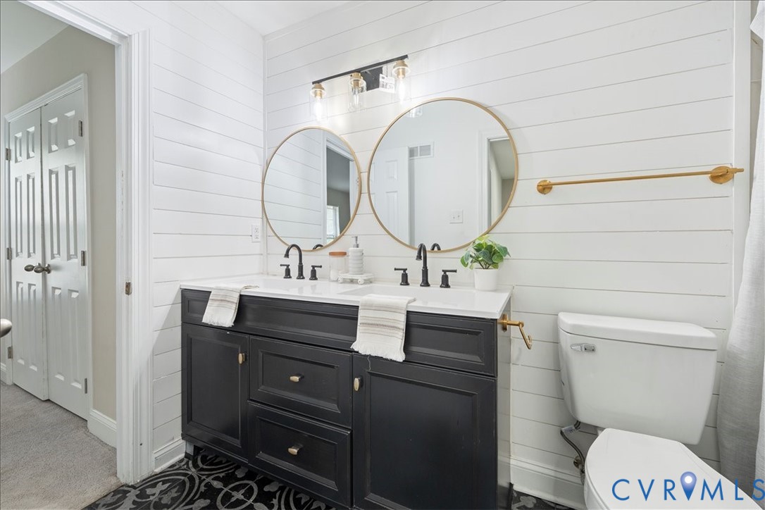11601 Timberly Waye Henrico, VA 23238 - Photo 22 of 39 a bathroom with a toilet a sink and mirror