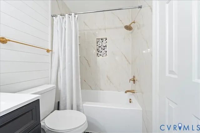 a bathroom with a shower a toilet and a shower