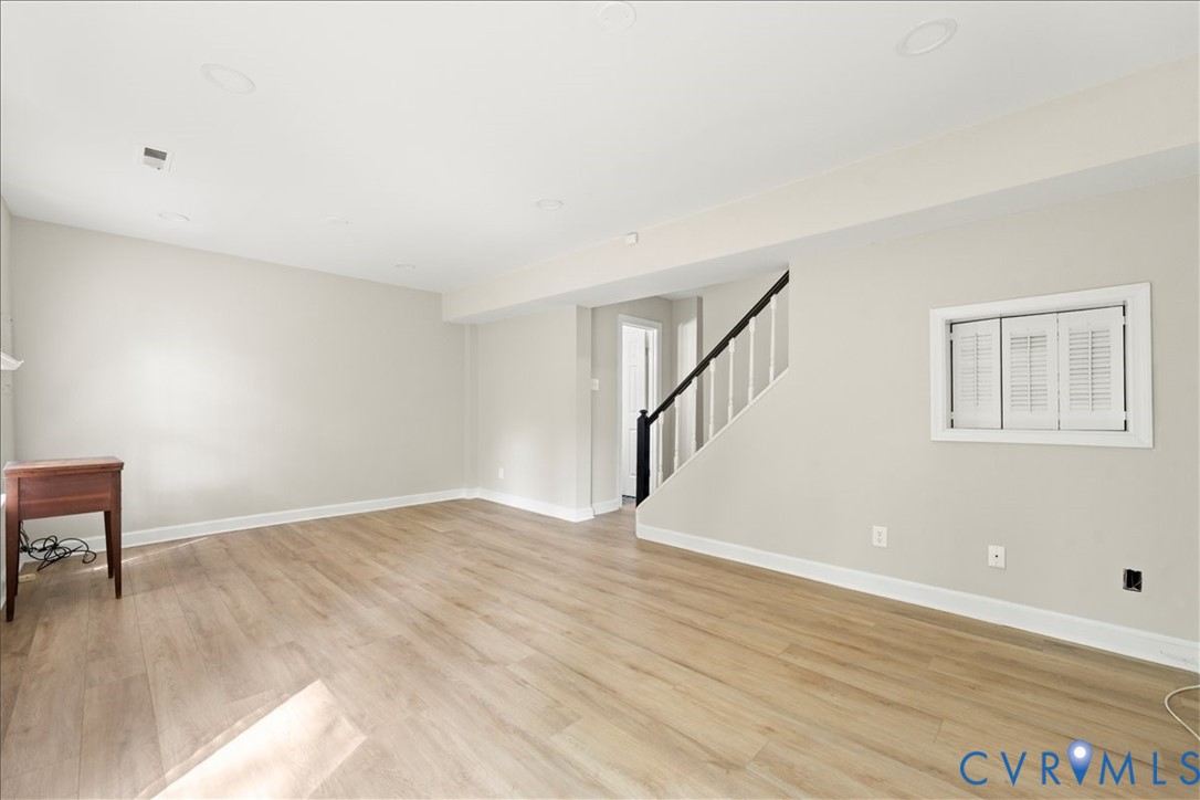 11601 Timberly Waye Henrico, VA 23238 - Photo 33 of 39 a view of an empty room with wooden floor and a window