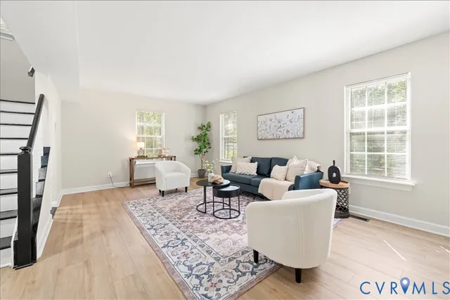 a living room with furniture and a rug
