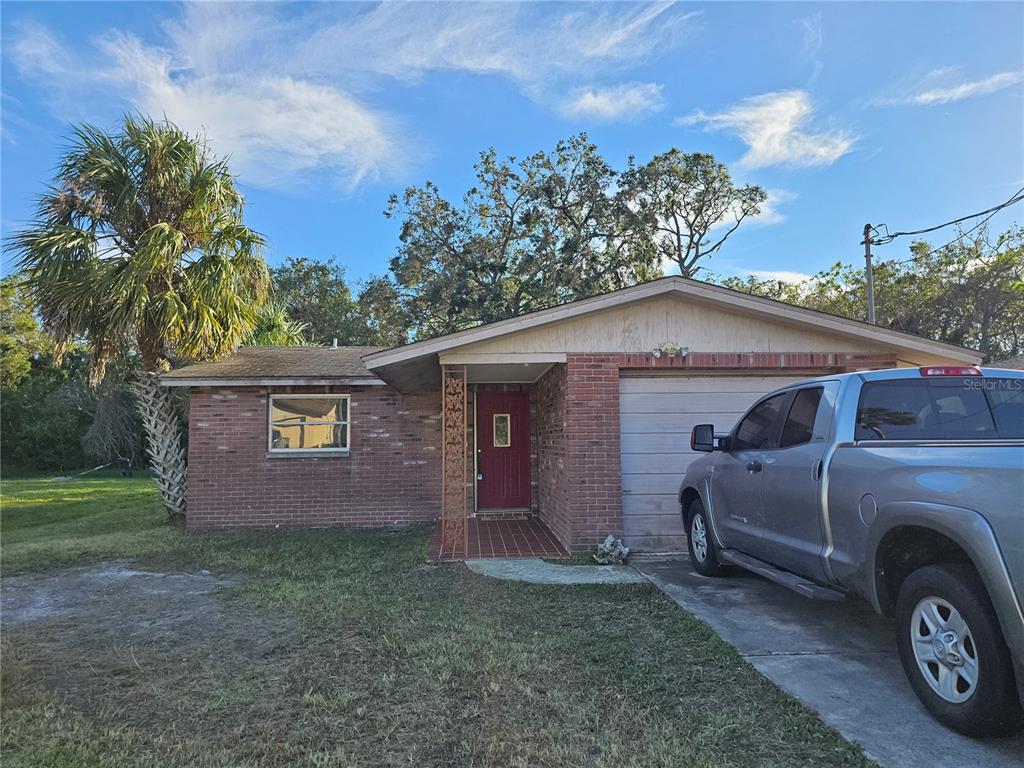 8030 Gulf Way Hudson, FL 34667 - Photo 1 of 1 a view of a house with a back yard