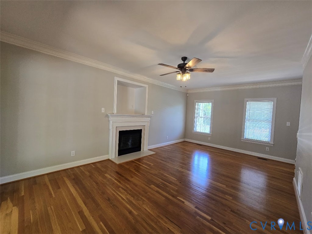 16406 Benmore Road Moseley, VA 23120 - Photo 9 of 32 a view of an empty room with wooden floor and a window