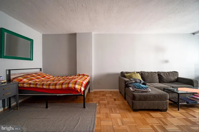 a kitchen with a stove a refrigerator and a sink