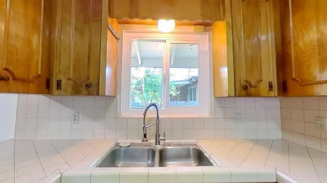 a bathroom with a sink and a large mirror