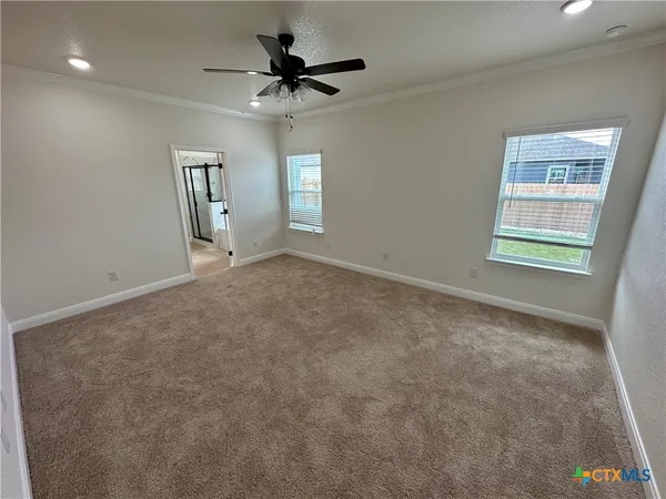 a view of an empty room with a window