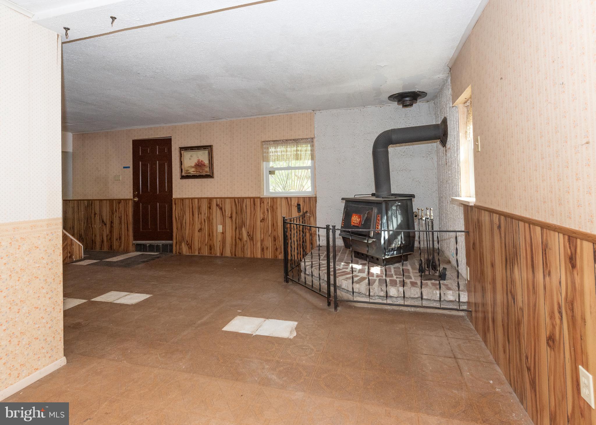 450 Weymouth Road Buena, NJ 08310 - Photo 22 of 48 a living room with furniture a flat screen tv and a fireplace