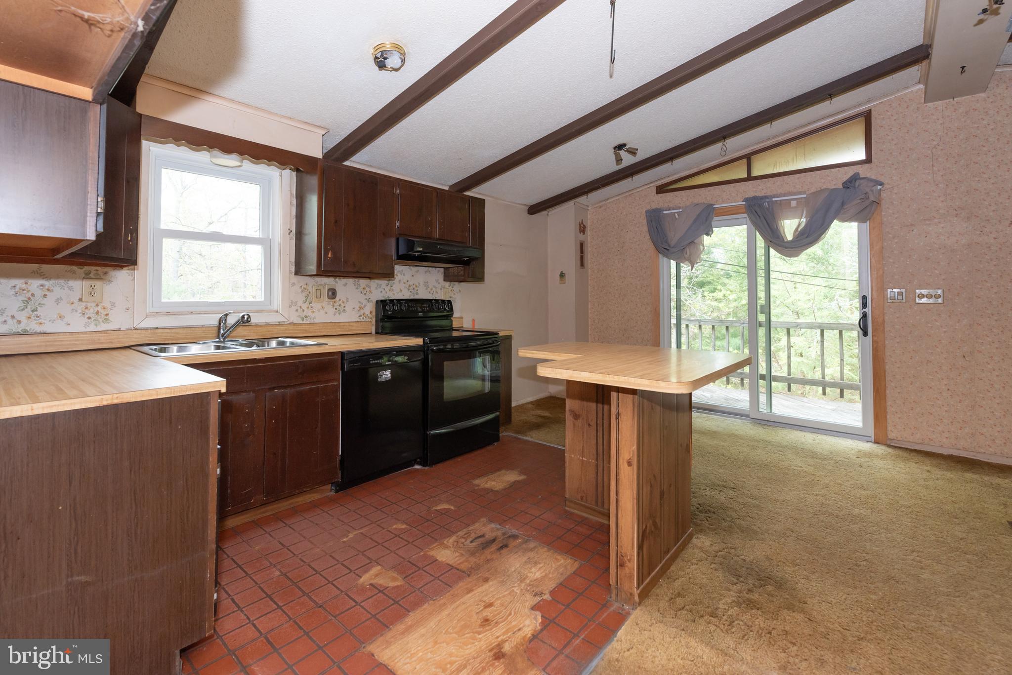 450 Weymouth Road Buena, NJ 08310 - Photo 41 of 48 a kitchen with stainless steel appliances granite countertop a stove a sink and a microwave