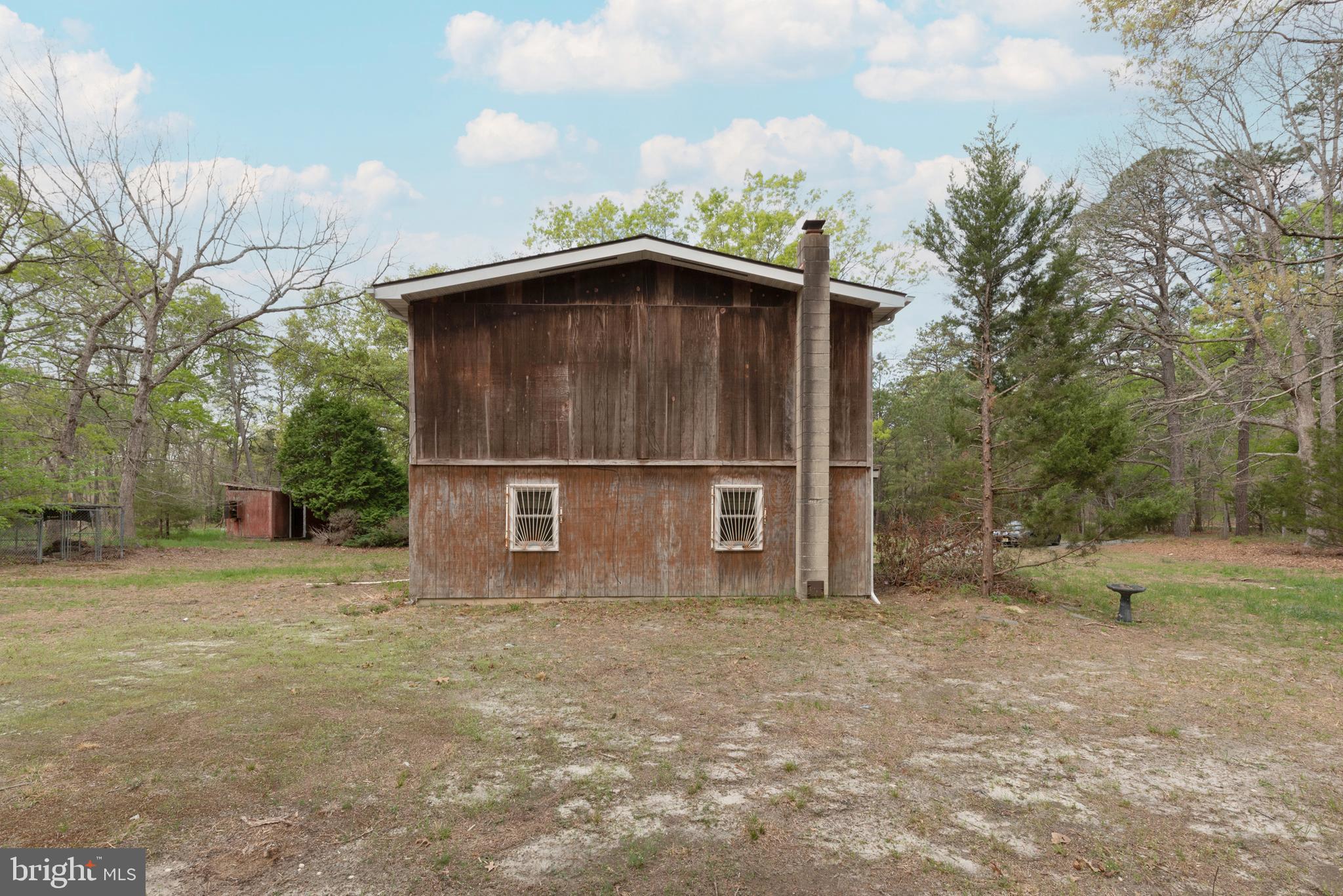 450 Weymouth Road Buena, NJ 08310 - Photo 6 of 48 a backyard of a house with table and chairs