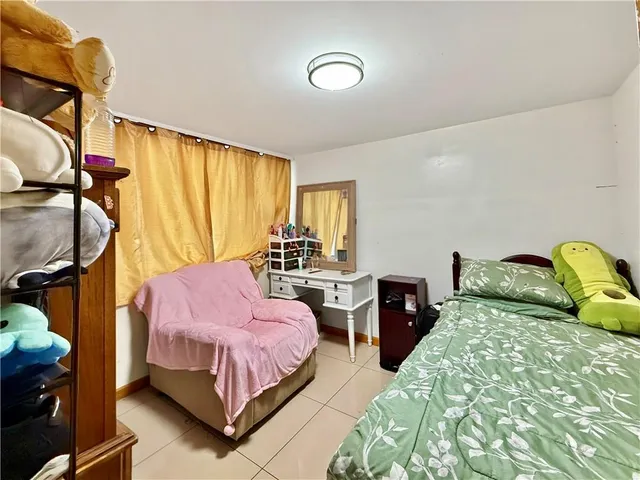 a room with furniture and a book shelf