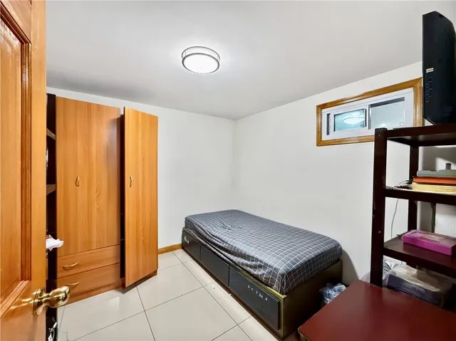 a bathroom with a shower sink vanity and toilet