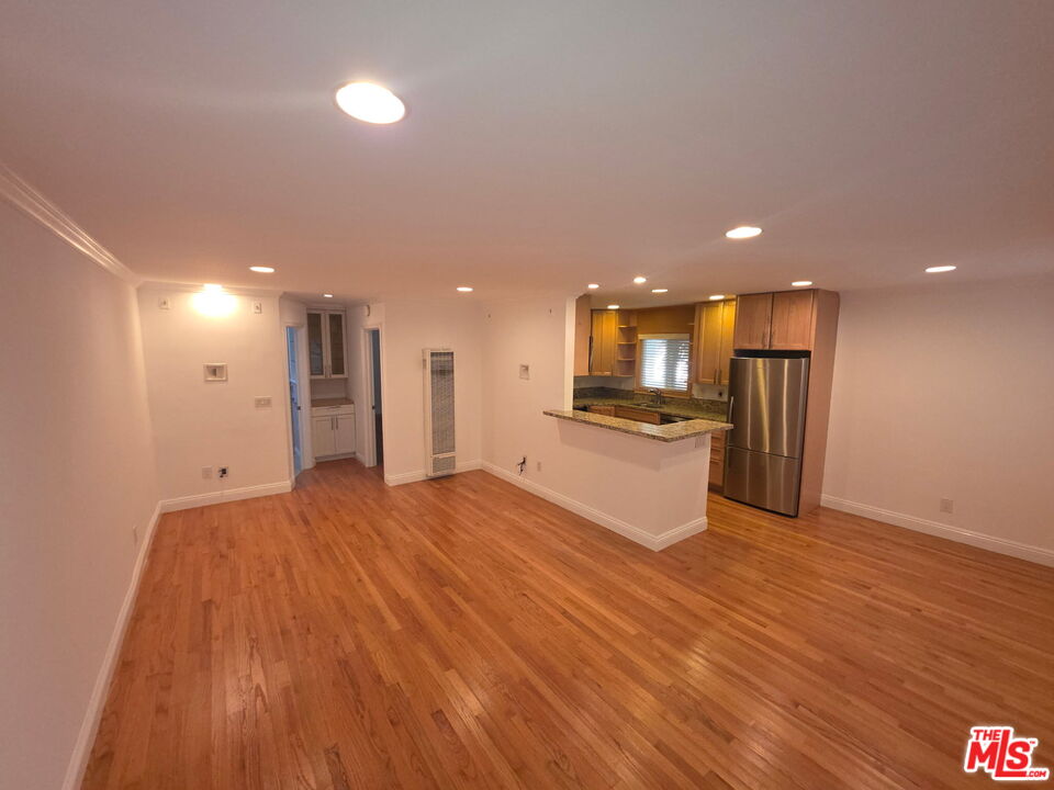 309 Broadway Street, Unit 6 Venice, CA 90291 - Photo 13 of 28 a view of kitchen with kitchen island wooden floor center island and stainless steel appliances