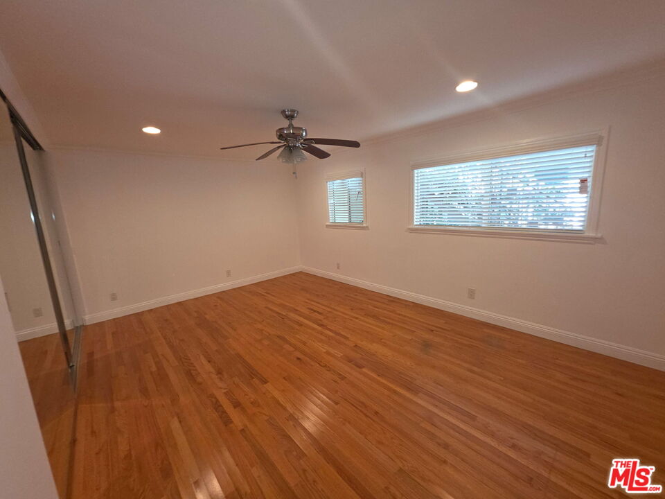 309 Broadway Street, Unit 6 Venice, CA 90291 - Photo 18 of 28 a view of empty room with wooden floor and fan