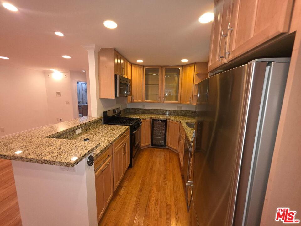 309 Broadway Street, Unit 6 Venice, CA 90291 - Photo 2 of 28 a kitchen with stainless steel appliances granite countertop a sink stove and refrigerator