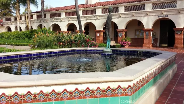 a view of swimming pool with a house in the background