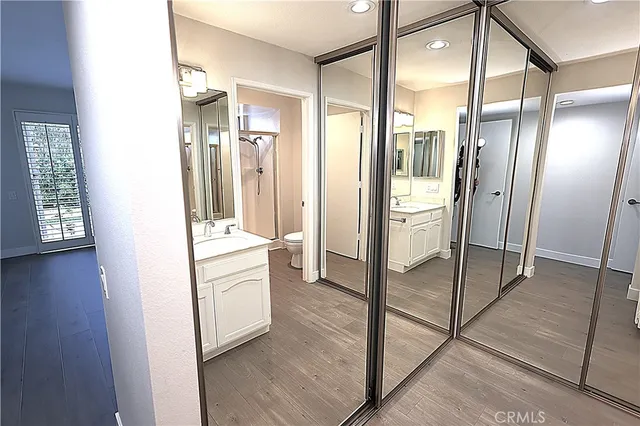 a bathroom with a shower and a sink