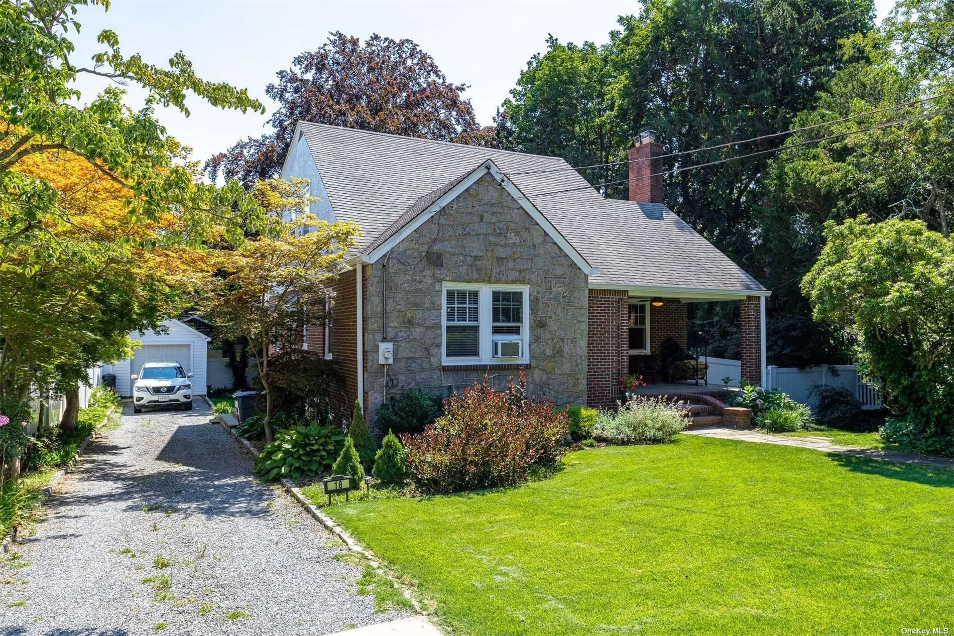 18 Roslyn Drive Glen Head, NY 11545 - Photo 1 of 1 a view of a house with a yard and sitting area
