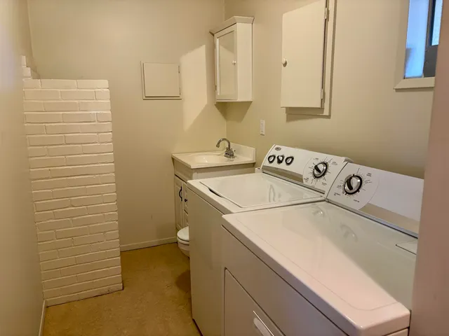a utility room with dryer and washer