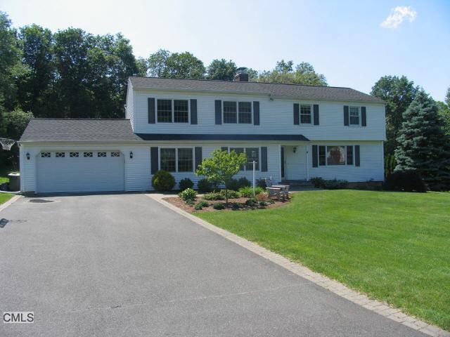 23 Apple Tree Road Bethel, CT 06801 - Photo 1 of 1 a front view of a house with a garden and patio