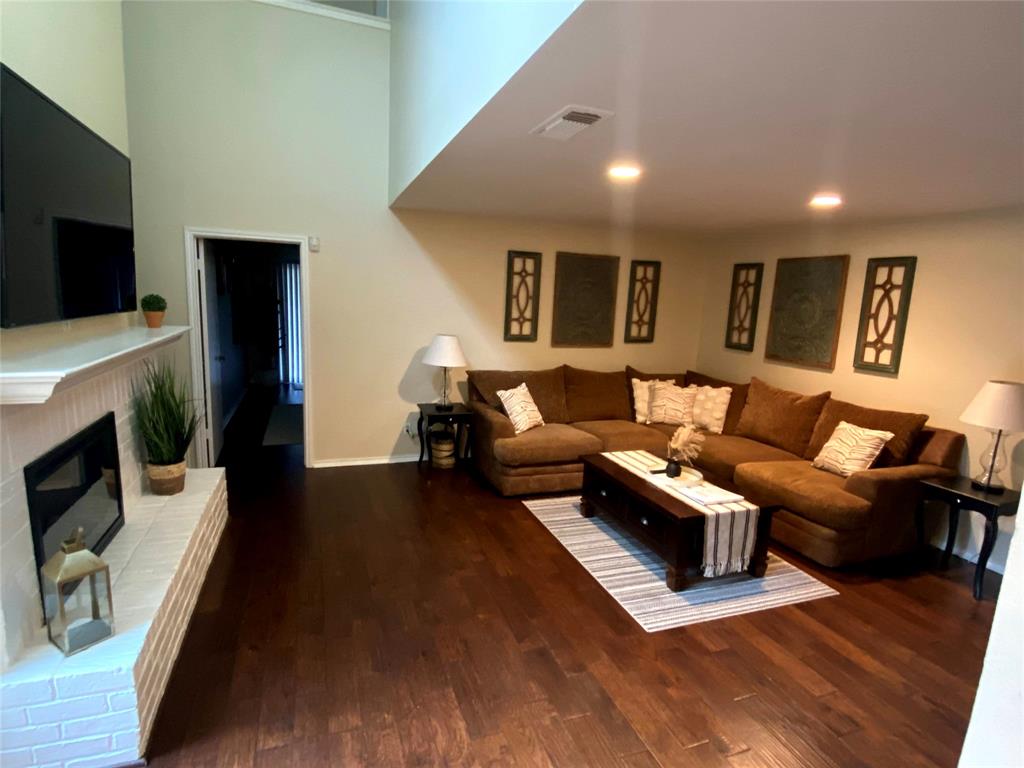 3325 Bristol Road Fort Worth, TX 76107 - Photo 9 of 26 a living room with fireplace furniture and a flat screen tv