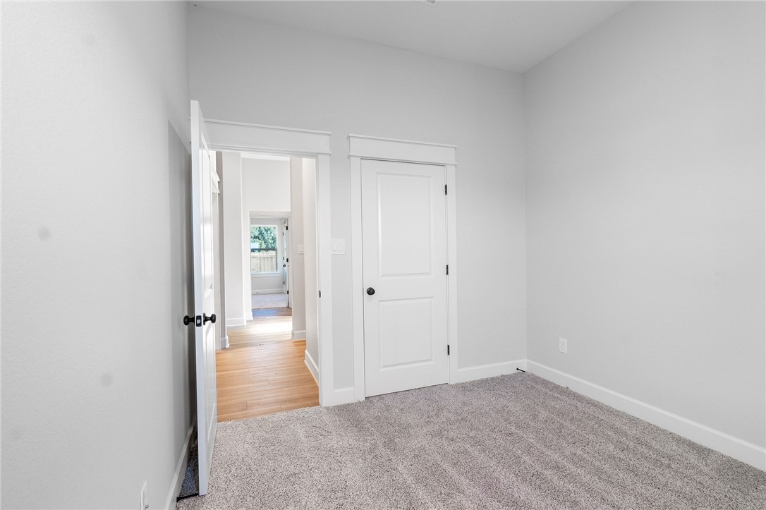 497 Combine Road Snook, TX 77879 - Photo 12 of 27 a view of a hallway with wooden floor