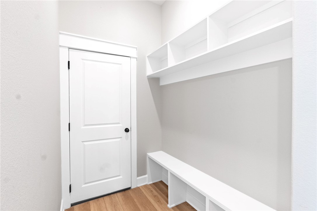 497 Combine Road Snook, TX 77879 - Photo 19 of 27 a view of closet with wooden floor