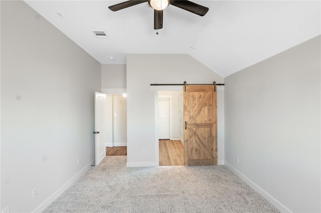 497 Combine Road Snook, TX 77879 - Photo 7 of 27 a view of hallway with a ceiling fan
