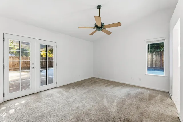 a view of house with swimming pool and yard