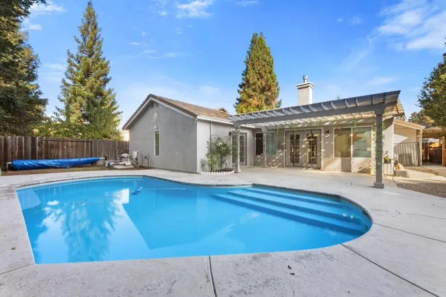 a view of a house with a swimming pool