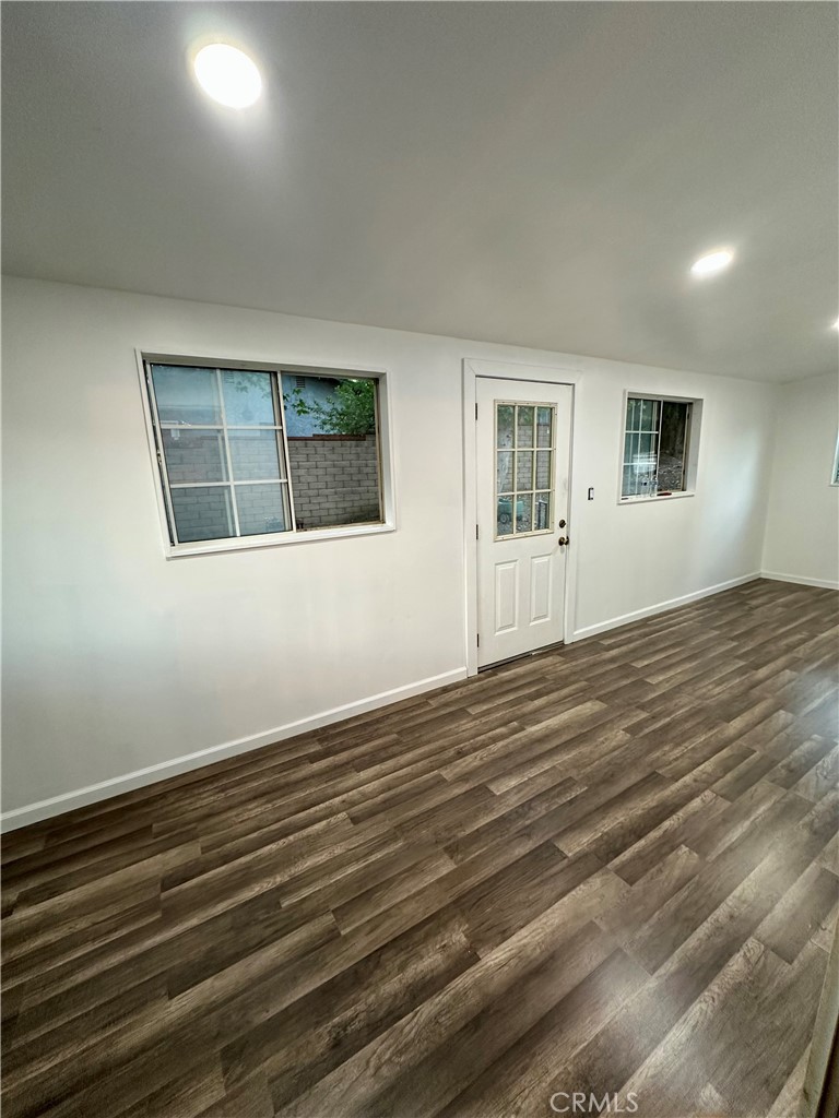 15609 Spunky Canyon Road Green Valley, CA 91390 - Photo 11 of 29 a view of an empty room with wooden floor and a window