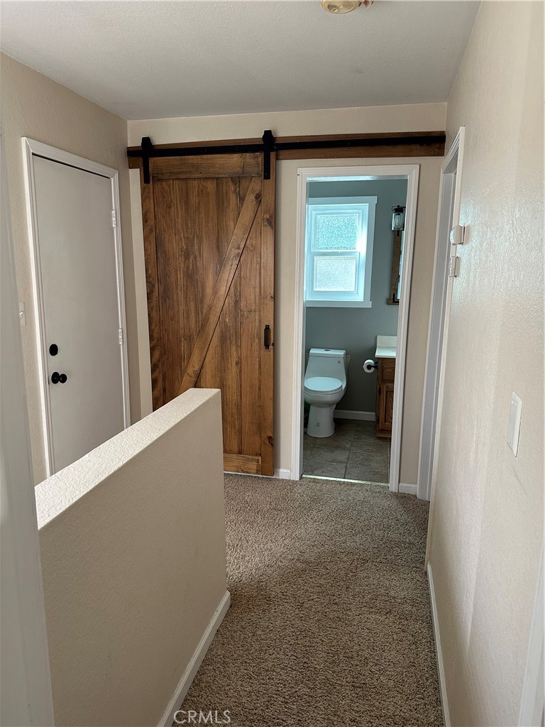 15609 Spunky Canyon Road Green Valley, CA 91390 - Photo 13 of 29 a view of a hallway with closet and bathroom