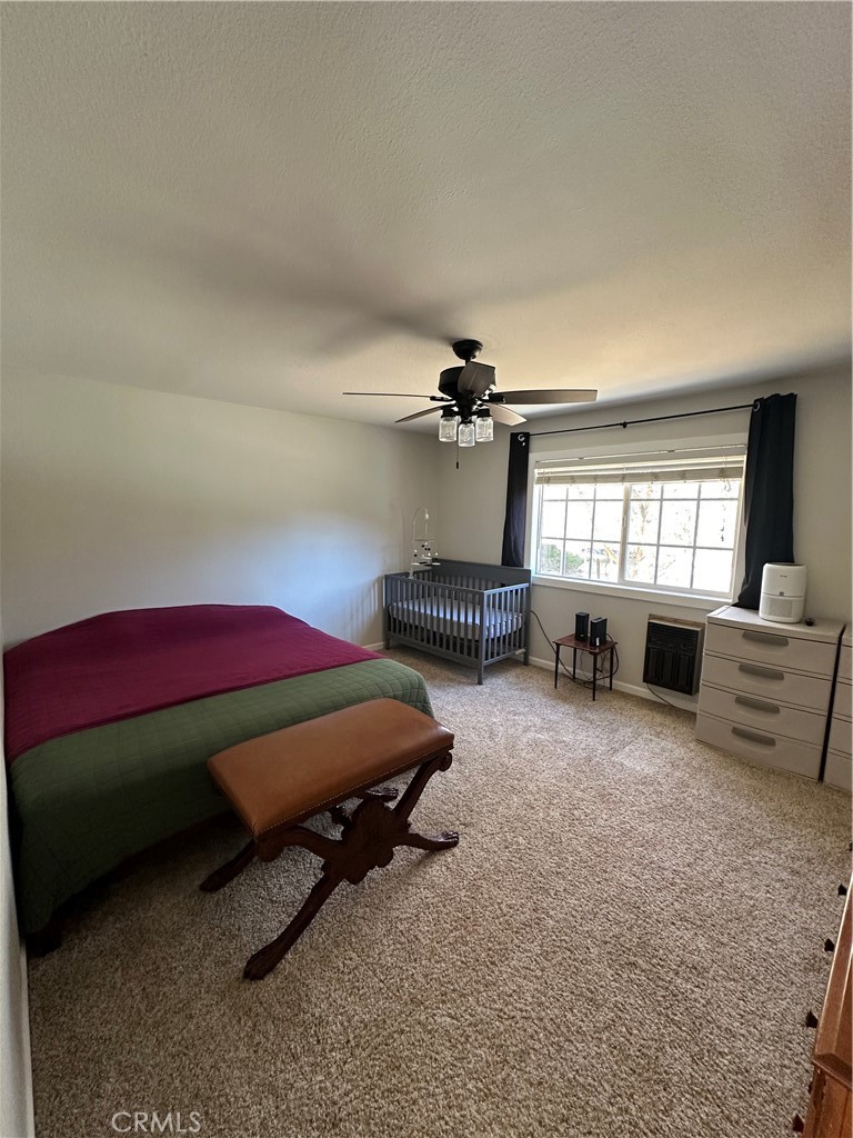 15609 Spunky Canyon Road Green Valley, CA 91390 - Photo 15 of 29 a bedroom with furniture and window
