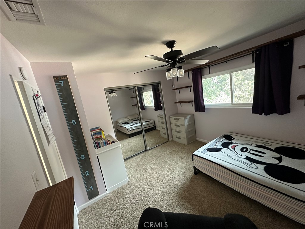 15609 Spunky Canyon Road Green Valley, CA 91390 - Photo 19 of 29 a living room with furniture and a flat screen tv